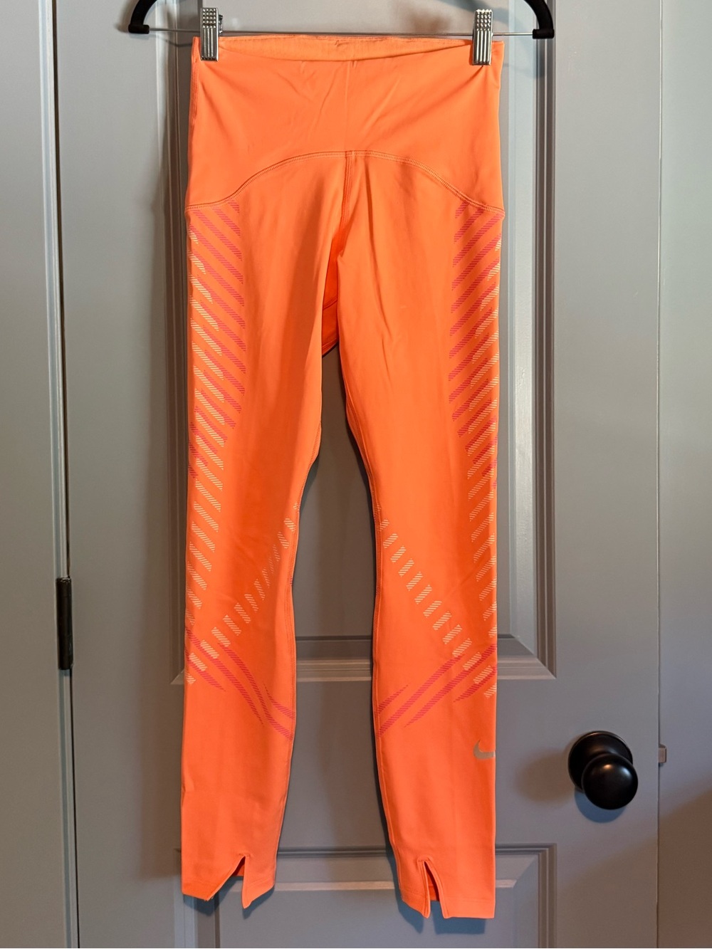 Women’s Nike orange athletic leggings.